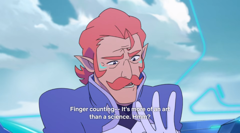 Coran of VLD holding up three fingers, subtitle reading “Finger counting–It’s more of an art than a science. Hmm?”